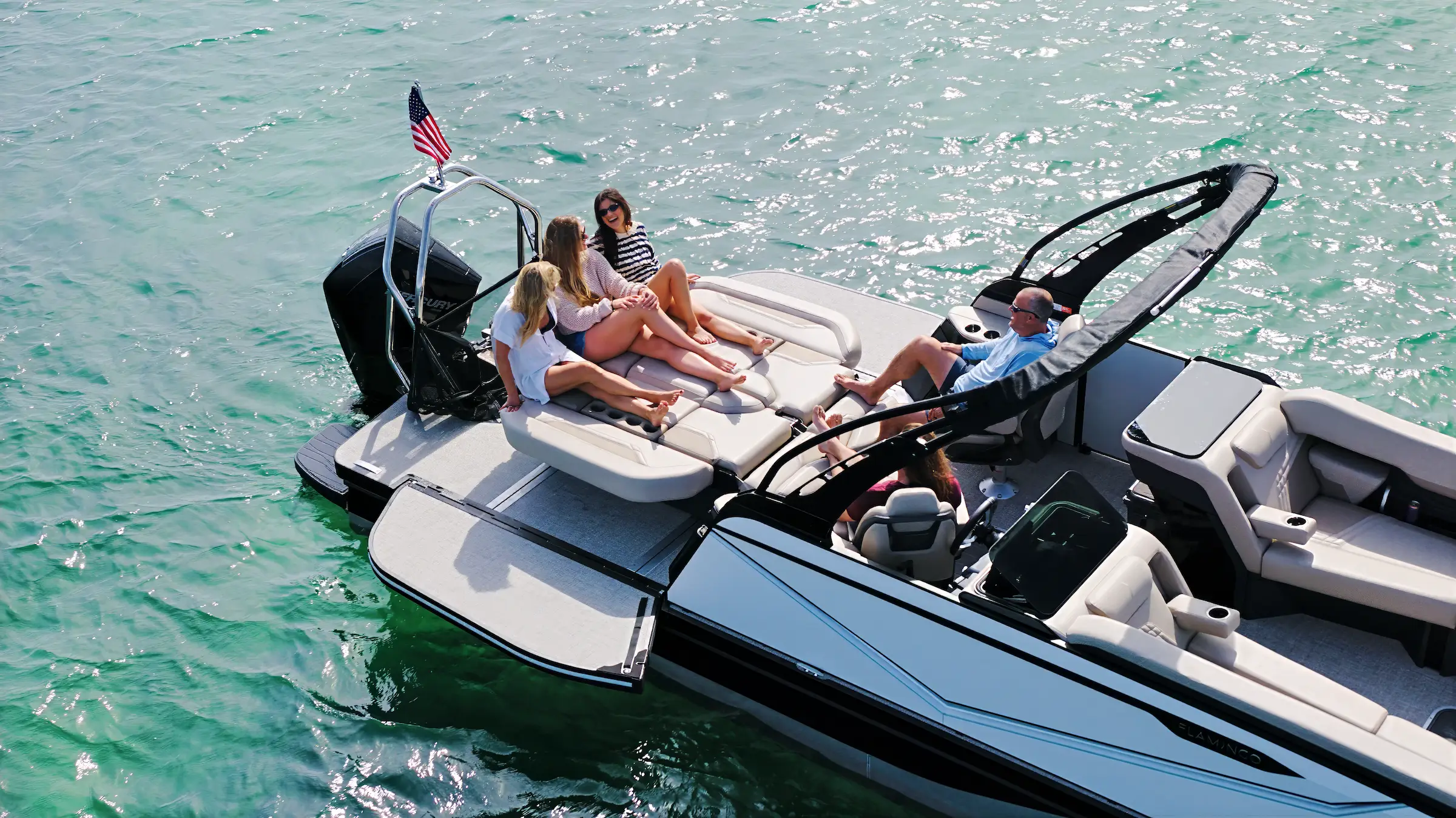 People relaxing aboard a Flamingo on the water