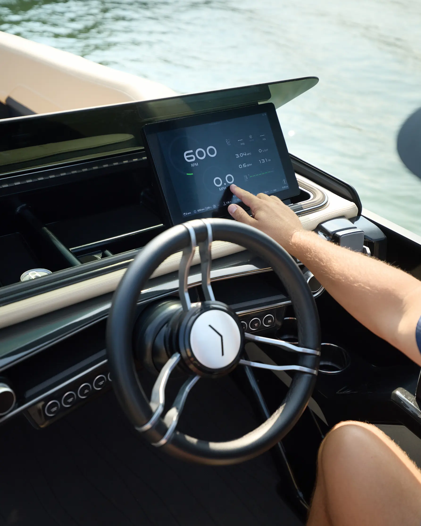 The ROVE helm — a hand on the digital touchscreen dashboard